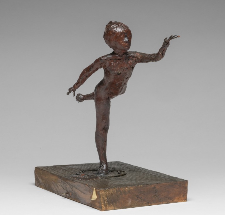 Arabesque over the Right Leg, Left Arm in Front. Degas, Edgar (French, 1834-1917). Red-brown wax, with wire armature which projects as fingers from the hands, and from the lifted foot; attached to rectangular wooden base. The nude dancer stands in an arabesque on her right leg with her left arm extended in front. Height, whole, 23.6 cm, height, wax, 20.6 cm,, circa 1882-1895.